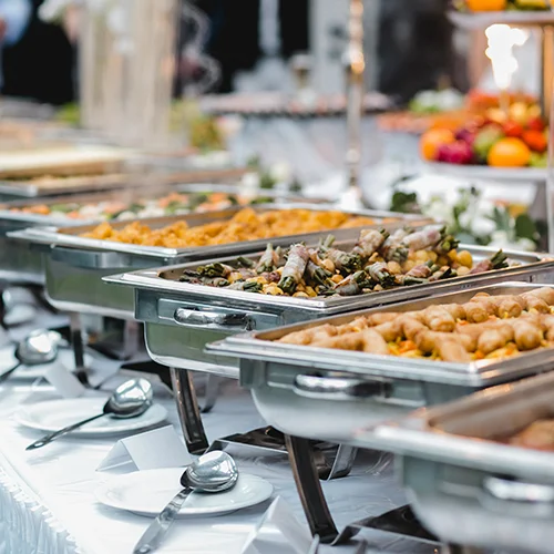 row-of-chafing-dishes-on-a-buffet-table